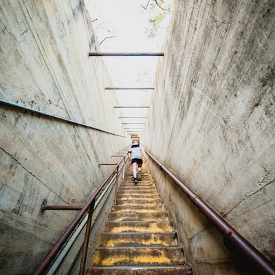 Woman climbing staircase